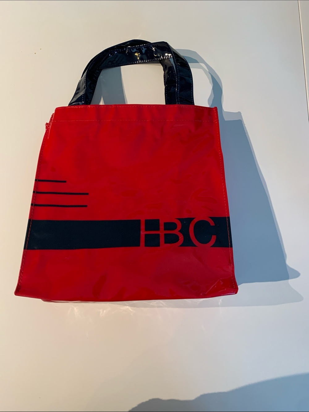 Red Tote Bag with Black Accent Handles and HBC Graphic